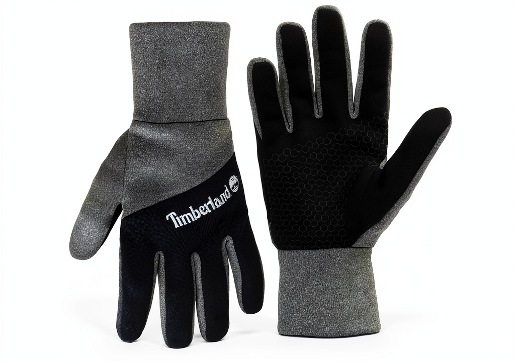 Man wearing Timberland colorblock fleece gloves while using a smartphone outdoors
